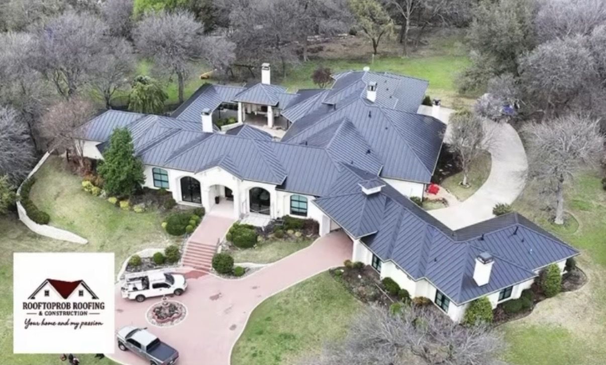 Standing-seam metal roof on a Texas luxury estate by Rooftoprob Roofing